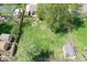 Aerial view of the expansive backyard with a fire pit and outbuildings at 251 Yorktown Rd, Greenwood, IN 46142