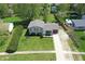 An elevated view of a charming two-story home with a well-maintained lawn and driveway at 251 Yorktown Rd, Greenwood, IN 46142