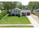An elevated view of a charming two-story home with a well-maintained lawn and driveway at 251 Yorktown Rd, Greenwood, IN 46142