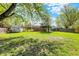 Spacious backyard featuring a storage shed and large grassy area at 251 Yorktown Rd, Greenwood, IN 46142