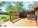 Wooden deck and patio overlooking the large backyard, secured by a wood fence at 251 Yorktown Rd, Greenwood, IN 46142