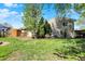 View of the backyard with a deck, seating area, trees, and an RV parked nearby at 251 Yorktown Rd, Greenwood, IN 46142