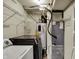 Basement utility room features washer, dryer, water heater, HVAC, and metal shelving at 251 Yorktown Rd, Greenwood, IN 46142