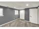 Finished basement space with neutral carpet, recessed lighting, and white trim throughout at 251 Yorktown Rd, Greenwood, IN 46142