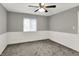 Bedroom features a window, gray walls with white trim, carpet, and a ceiling fan at 251 Yorktown Rd, Greenwood, IN 46142