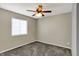 Bedroom featuring a window, neutral paint, plush carpet, and a ceiling fan at 251 Yorktown Rd, Greenwood, IN 46142
