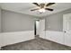 Bedroom features gray walls, white trim, plush carpet, and a ceiling fan at 251 Yorktown Rd, Greenwood, IN 46142