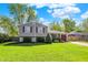 Charming two-story home with stone accents, manicured lawn, and attached garage on a sunny day at 251 Yorktown Rd, Greenwood, IN 46142