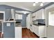 Well-lit kitchen with white cabinets, modern appliances, and hardwood flooring at 251 Yorktown Rd, Greenwood, IN 46142