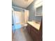 Well-lit bathroom with a tub and shower combination, single vanity, and tile flooring at 2629 Calabash Dr, Indianapolis, IN 46217