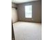 Neutral bedroom with a window, neutral carpet, and a closet at 2629 Calabash Dr, Indianapolis, IN 46217