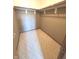 Empty walk-in closet with carpeted floor and rod for hanging clothes, ready for organization at 2629 Calabash Dr, Indianapolis, IN 46217
