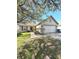 Charming one-story home with a two-car garage and mature tree in the front yard at 2629 Calabash Dr, Indianapolis, IN 46217