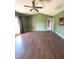 Bright living room featuring vaulted ceilings, wood floors, and patio doors at 2629 Calabash Dr, Indianapolis, IN 46217