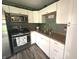 Kitchen shows white cabinets, stainless appliances, plenty of storage, and stylish decor at 2650 Woodrow Ave, Indianapolis, IN 46241