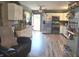 Modern kitchen with stainless steel appliances, plenty of cabinet space, and open access to the backyard at 2650 Woodrow Ave, Indianapolis, IN 46241