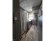 This laundry room features a modern washer and dryer set, cabinet for storage, and neutral colored walls at 2650 Woodrow Ave, Indianapolis, IN 46241