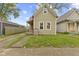 Charming home featuring a well-maintained lawn and quaint architectural details at 314 N Reisner St, Indianapolis, IN 46222