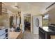 A kitchen features dated appliances and an open doorway at 314 N Reisner St, Indianapolis, IN 46222