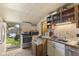 Functional kitchen with stainless steel appliances and backyard access, perfect for convenient outdoor dining at 314 N Reisner St, Indianapolis, IN 46222