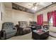 A living room features several recliner chairs and a ceiling fan at 314 N Reisner St, Indianapolis, IN 46222