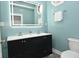 Updated bath with dual-sink vanity, lighted mirror, and modern fixtures at 344 N Addison St, Indianapolis, IN 46222