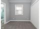 Carpeted bedroom with natural light and attached closet at 344 N Addison St, Indianapolis, IN 46222