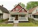 Charming two-story home with a covered front porch and nicely landscaped yard at 344 N Addison St, Indianapolis, IN 46222