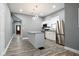 Open kitchen features stainless appliances, center island, and modern lighting at 344 N Addison St, Indianapolis, IN 46222