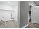 Laundry room featuring hookups, shelving, and a convenient half bathroom at 344 N Addison St, Indianapolis, IN 46222