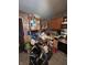 This is an image of a cluttered kitchen with a stainless steel oven, microwave, and cabinets that is in need of decluttering at 3742 S Walcott St, Indianapolis, IN 46227