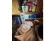 A shot of the pantry with cabinets full of canned foods and snacks, needing decluttering at 3742 S Walcott St, Indianapolis, IN 46227