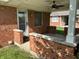 Back porch featuring red brick, a ceiling fan, and a covered seating area at 379 Vinewood N Dr, Brownsburg, IN 46112
