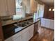 Bright kitchen featuring stainless steel sink and modern white cabinetry and hardware at 379 Vinewood N Dr, Brownsburg, IN 46112
