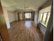 Spacious living room with hardwood floors, gray walls, and lots of natural light from large windows at 379 Vinewood N Dr, Brownsburg, IN 46112