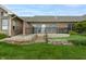 Backyard featuring a stone retaining wall and patio, perfect for outdoor entertaining at 4061 Melbourne Dr, Columbus, IN 47203