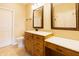 Bathroom features granite countertops, double vanity, and a large, framed mirror at 4061 Melbourne Dr, Columbus, IN 47203
