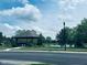 Charming community gazebo overlooking a tranquil pond, with mature trees and lush landscaping at 4061 Melbourne Dr, Columbus, IN 47203