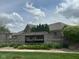 Elegant stone wall and landscaping with a prominent sign for Villas of Stonecrest community at 4061 Melbourne Dr, Columbus, IN 47203