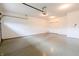 Clean garage featuring epoxy flooring, storage options, and an automatic door opener at 4061 Melbourne Dr, Columbus, IN 47203