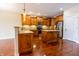 Bright kitchen with granite countertops, wooden cabinets, a center island, and stainless appliances at 4061 Melbourne Dr, Columbus, IN 47203