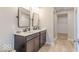Bathroom featuring double sink vanity with quartz countertop and modern fixtures at 4722 E Shadowbrook Dr, Camby, IN 46113