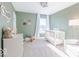 Bedroom with soft green walls, white crib, and neutral decor, creating a calm and inviting space at 4722 E Shadowbrook Dr, Camby, IN 46113