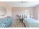Pink bedroom features a decorative dresser, accent mirror, and a twin bed at 4722 E Shadowbrook Dr, Camby, IN 46113