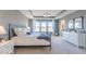 Bedroom with a metal bed, nightstands and windows that fill the room with light at 4722 E Shadowbrook Dr, Camby, IN 46113