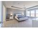 Bedroom with bed with metal frame, nightstands and windows bringing in natural light at 4722 E Shadowbrook Dr, Camby, IN 46113