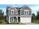 Charming two-story home showcasing board and batten siding, white trim, and an attached two car garage at 4722 E Shadowbrook Dr, Camby, IN 46113