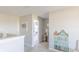Hallway with house-shaped decoration leading to bedrooms, filled with natural light at 4722 E Shadowbrook Dr, Camby, IN 46113