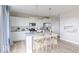 Beautiful kitchen with white cabinets, stainless steel appliances, quartz counters, and island seating at 4722 E Shadowbrook Dr, Camby, IN 46113