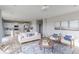 Inviting living room with plush seating, stylish decor, hardwood floors, and views into the kitchen at 4722 E Shadowbrook Dr, Camby, IN 46113